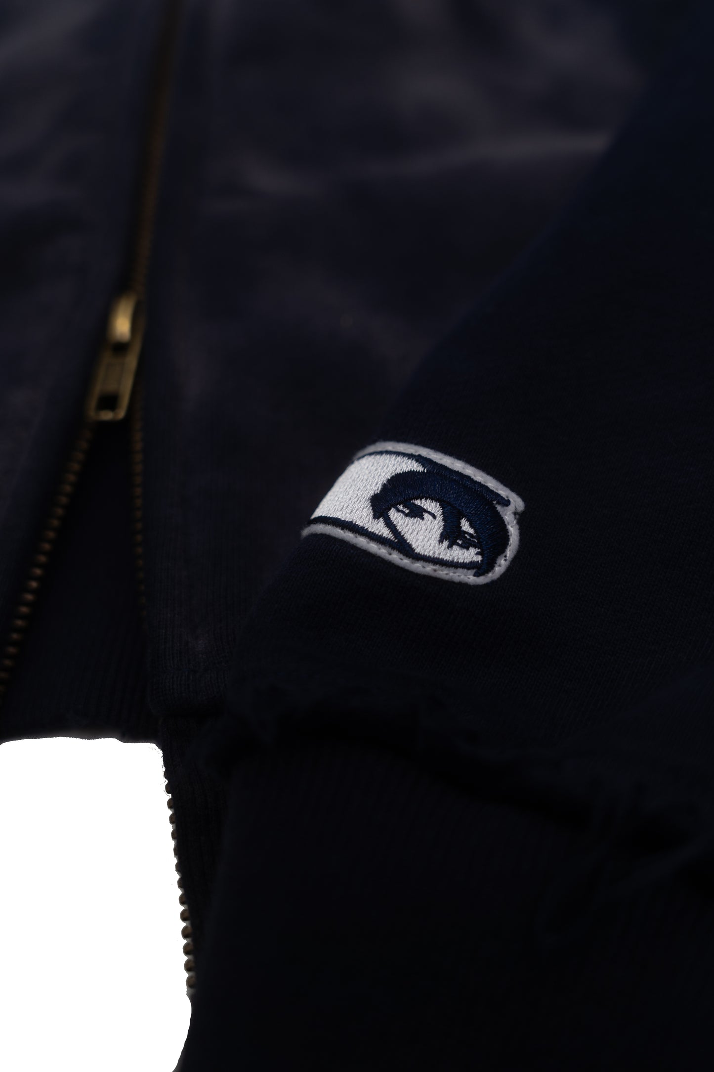 worn navy zip up
